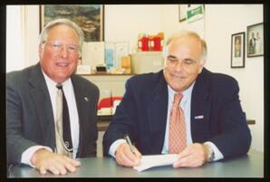 Rep. Thomas Tangretti and Governor Edward Rendell seated at a table, possibly at Rep. Tangretti's district office.