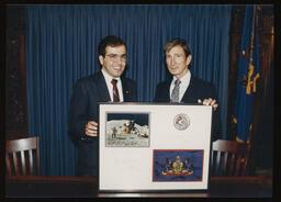 Rep. Thomas Scrimenti with Colonel James B. Irwin holding a framed item