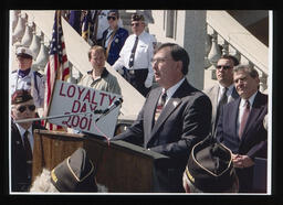 Rep. Paul A. Semmel at the podium giving a speech during Loyalty Day.