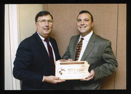 Rep. Paul Semmel stands receiving his 2003 Legislator of the Year award.
